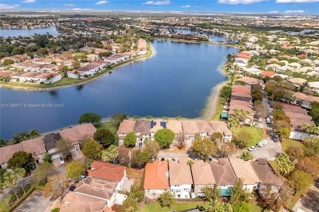 birds eye view of property featuring a residential view and a water view
