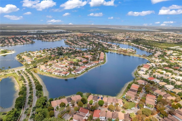 bird's eye view featuring a residential view and a water view