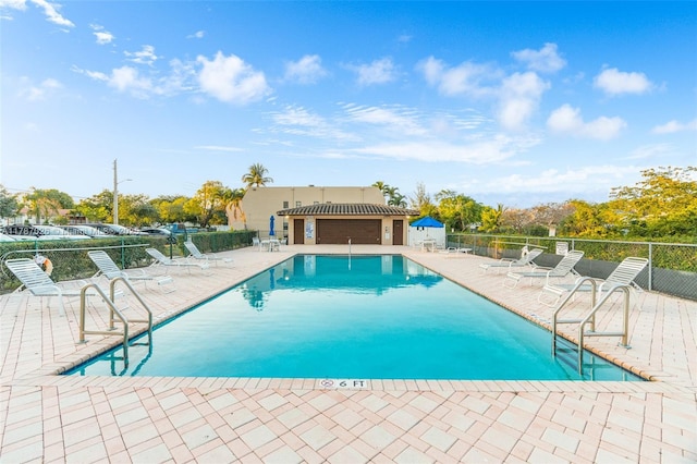 3111 Coral Springs Dr Unit 211, Coral Springs, FL 33065 - community pool featuring a patio area