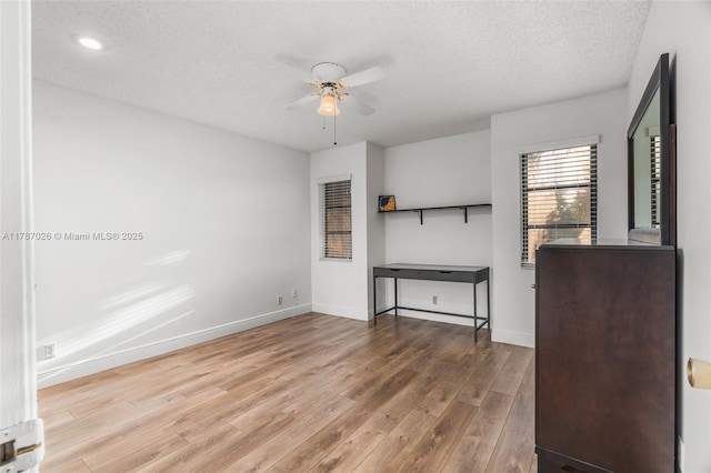 3111 Coral Springs Dr Unit 211, Coral Springs, FL 33065 - unfurnished living room featuring a ceiling fan, wood finished floors, a textured ceiling, baseboards, and recessed lighting