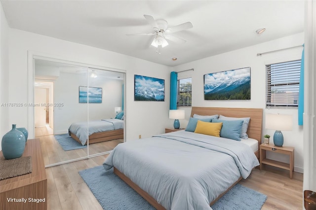 3111 Coral Springs Dr Unit 211, Coral Springs, FL 33065 - bedroom featuring a closet, light wood finished floors, baseboards, and ceiling fan