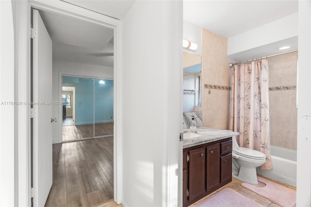 3111 Coral Springs Dr Unit 211, Coral Springs, FL 33065 - full bathroom with vanity, shower / tub combo, toilet, and wood finished floors