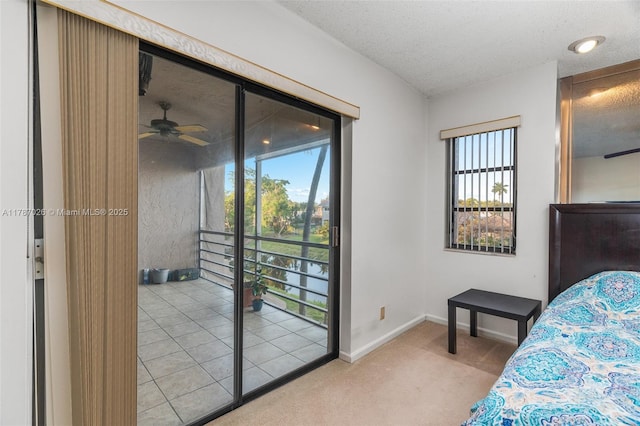 3111 Coral Springs Dr Unit 211, Coral Springs, FL 33065 - carpeted bedroom with access to outside, baseboards, and a textured ceiling