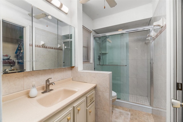 3111 Coral Springs Dr Unit 211, Coral Springs, FL 33065 - full bath with ceiling fan, vanity, a stall shower, toilet, and ornamental molding