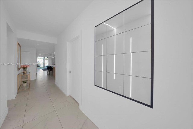 10700 NW 66th St Unit 103, Doral, FL 33178 - hallway with light marble finish flooring