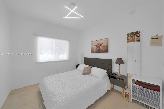 10700 NW 66th St Unit 103, Doral, FL 33178 - bedroom featuring light marble finish flooring and baseboards