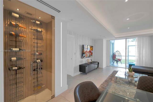 10700 NW 66th St Unit 103, Doral, FL 33178 - wine area featuring baseboards, recessed lighting, and marble finish floors