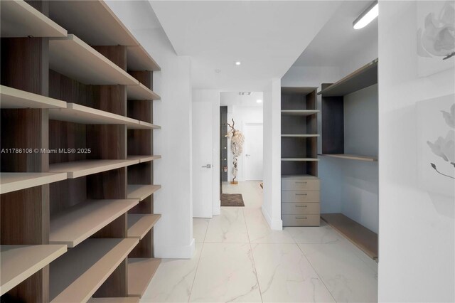 10700 NW 66th St Unit 103, Doral, FL 33178 - spacious closet featuring light marble finish floors