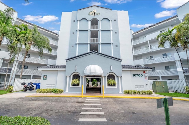 10700 NW 66th St Unit 103, Doral, FL 33178 - view of apartment building / complex with uncovered parking
