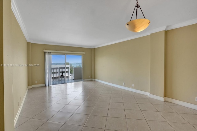 unfurnished room featuring crown molding, baseboards, and light tile patterned floors