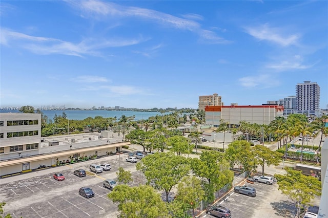 aerial view featuring a view of city and a water view