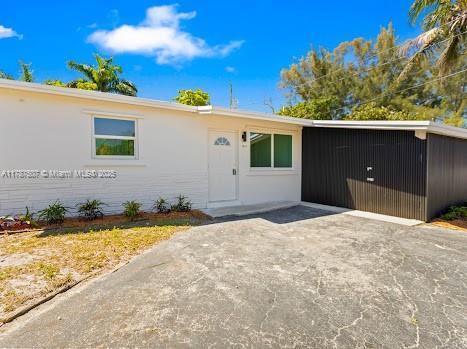 1310 NW 41st St, Oakland Park, FL 33309 - view of single story home