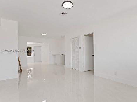 1310 NW 41st St, Oakland Park, FL 33309 - unfurnished room featuring baseboards and visible vents