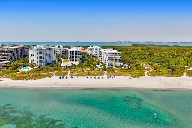 drone / aerial view featuring a view of the beach and a water view