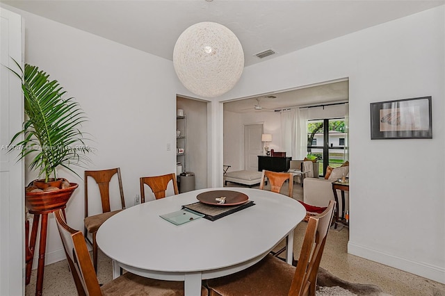 430 NE 132nd Ter, North Miami, FL 33161 - dining room with speckled floor, baseboards, and visible vents