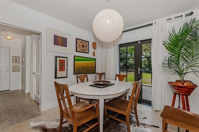 430 NE 132nd Ter, North Miami, FL 33161 - dining area featuring light speckled floor, french doors, and baseboards