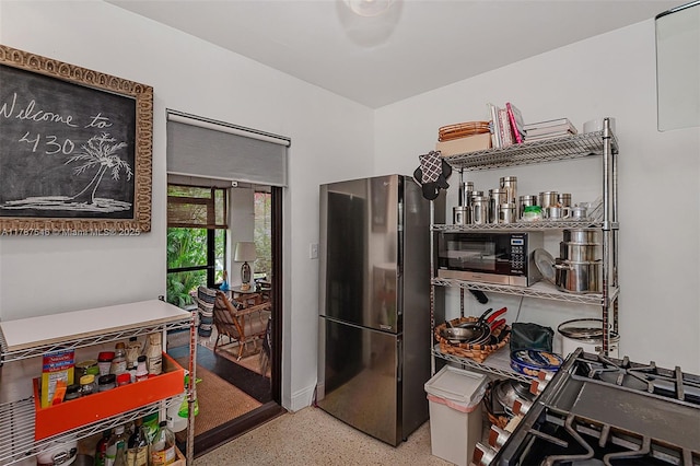 430 NE 132nd Ter, North Miami, FL 33161 - kitchen with speckled floor and stainless steel appliances