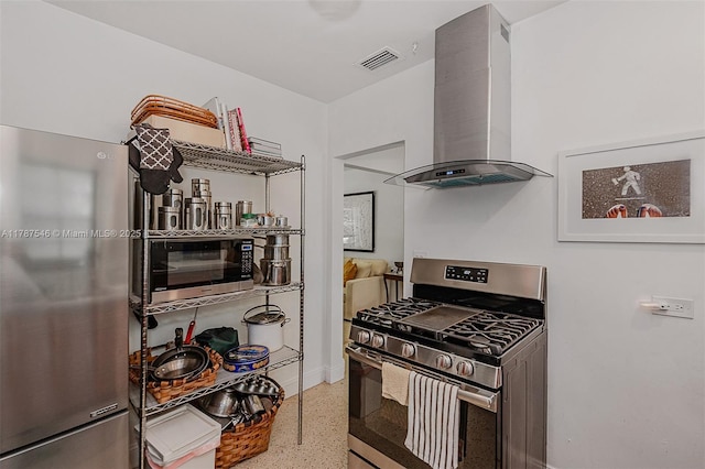 430 NE 132nd Ter, North Miami, FL 33161 - kitchen with stainless steel appliances, speckled floor, visible vents, wall chimney exhaust hood, and baseboards