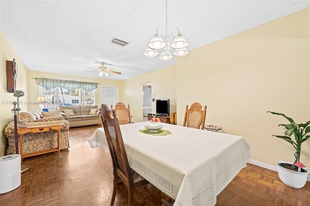dining area with visible vents, baseboards, and ceiling fan with notable chandelier