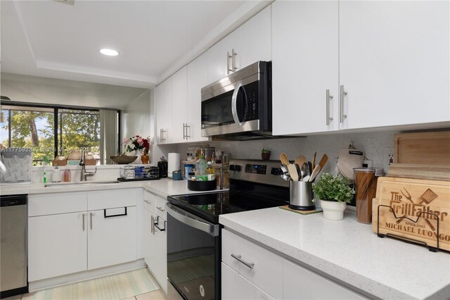 2801 SW 87th Ave Unit 1006, Davie, FL 33328 - kitchen featuring appliances with stainless steel finishes, a sink, white cabinets, and recessed lighting