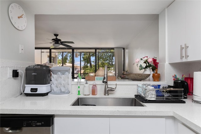 2801 SW 87th Ave Unit 1006, Davie, FL 33328 - kitchen featuring light stone counters, a sink, dishwasher, ceiling fan, and white cabinetry