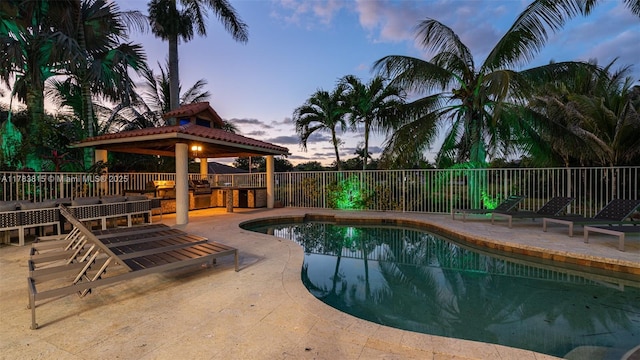1430 NW 114th Ave, Plantation, FL 33323 - pool at dusk featuring a gazebo, a patio area, and fence