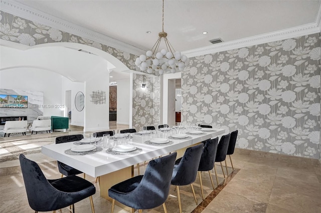 1430 NW 114th Ave, Plantation, FL 33323 - dining space with wallpapered walls, arched walkways, baseboards, and crown molding