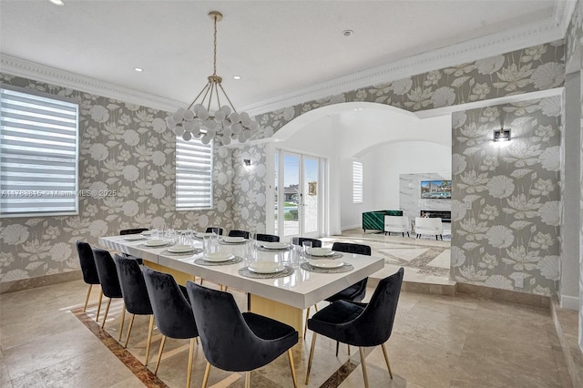 1430 NW 114th Ave, Plantation, FL 33323 - dining space featuring wallpapered walls, arched walkways, a fireplace, baseboards, and ornamental molding