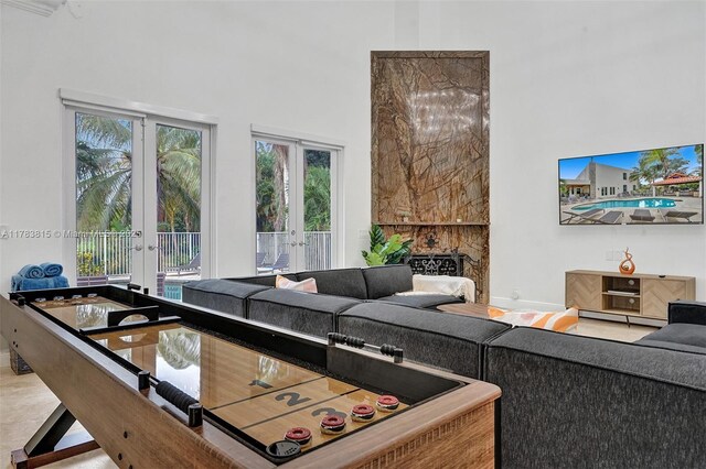 1430 NW 114th Ave, Plantation, FL 33323 - living area with french doors, a high ceiling, and baseboards