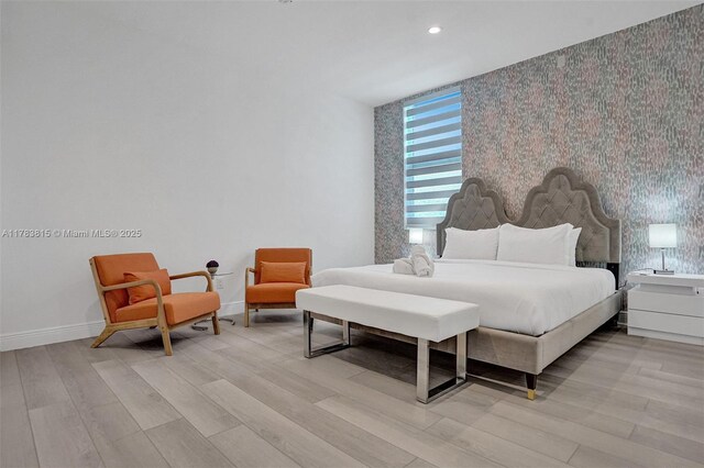 1430 NW 114th Ave, Plantation, FL 33323 - bedroom featuring wallpapered walls, baseboards, light wood-style floors, an accent wall, and recessed lighting