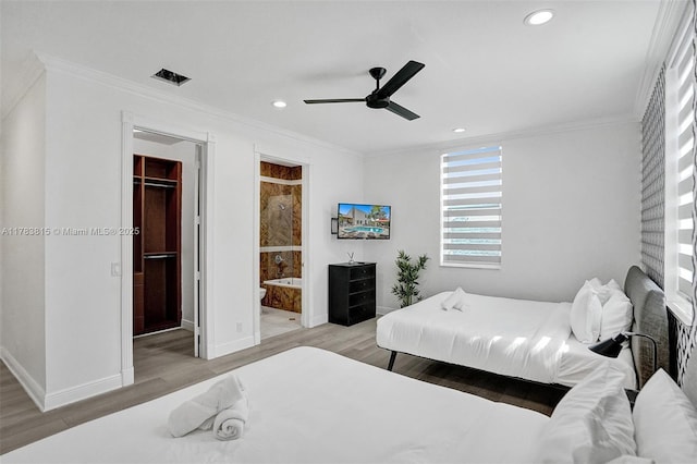 1430 NW 114th Ave, Plantation, FL 33323 - bedroom with crown molding, light wood-style floors, baseboards, a walk in closet, and recessed lighting