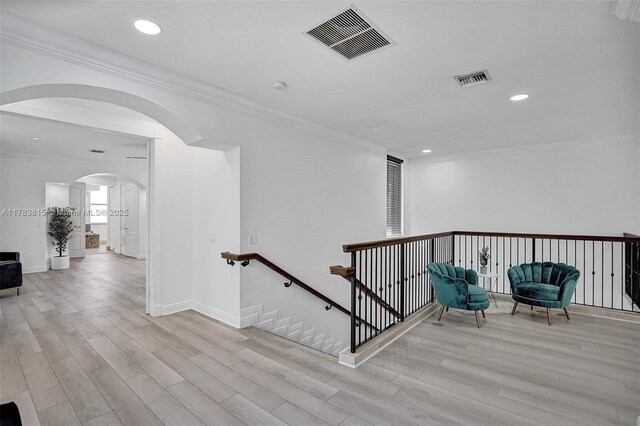 1430 NW 114th Ave, Plantation, FL 33323 - hallway with an upstairs landing, ornamental molding, wood finished floors, arched walkways, and recessed lighting