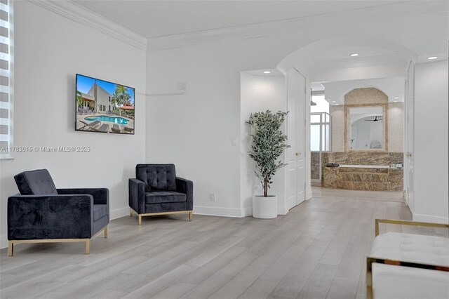 1430 NW 114th Ave, Plantation, FL 33323 - living area featuring wood finished floors, arched walkways, crown molding, baseboards, and recessed lighting