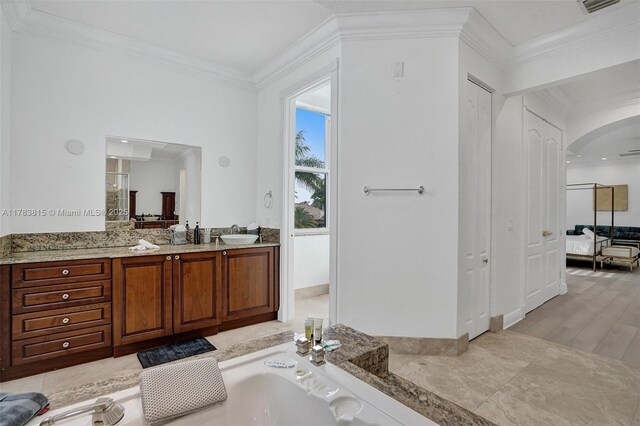 1430 NW 114th Ave, Plantation, FL 33323 - bathroom with crown molding, double vanity, a garden tub, and wood finished floors