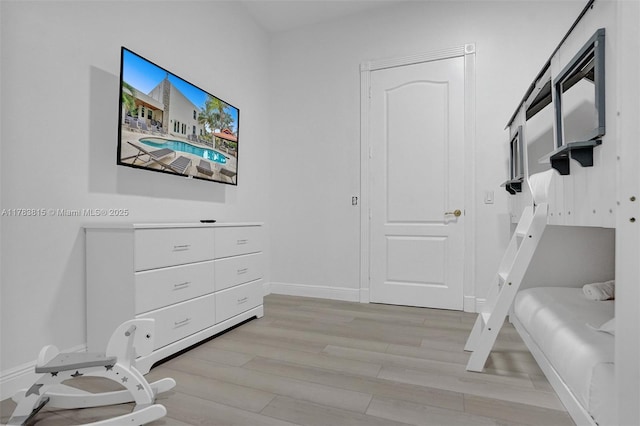 1430 NW 114th Ave, Plantation, FL 33323 - bedroom featuring light wood-type flooring and baseboards