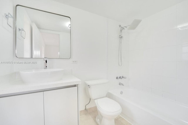 bathroom featuring vanity, toilet, shower / washtub combination, and tile patterned floors
