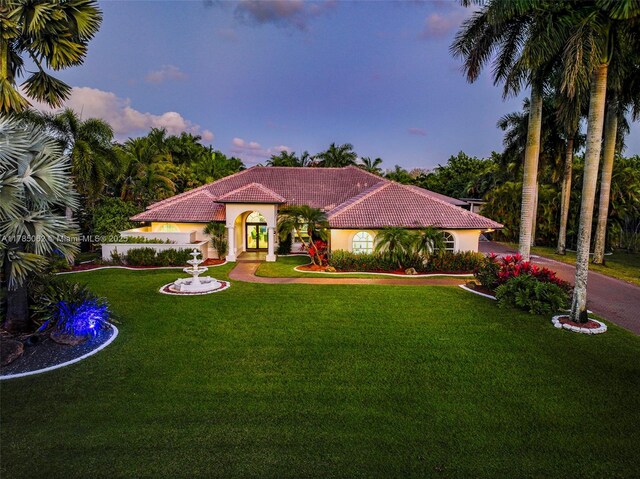 3152 SW 147th Ave, Davie, FL 33330 - mediterranean / spanish home with a tiled roof, a front yard, and stucco siding