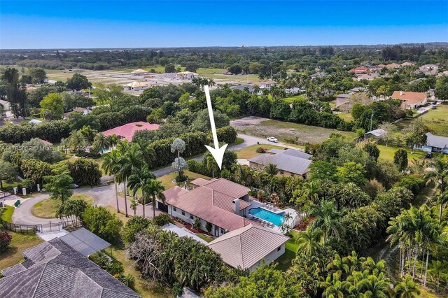 3152 SW 147th Ave, Davie, FL 33330 - drone / aerial view of a pool and a tree filled landscape