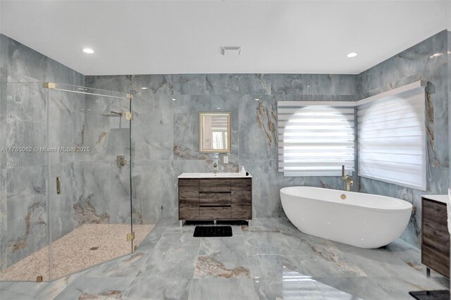 3152 SW 147th Ave, Davie, FL 33330 - full bathroom with tile walls, a marble finish shower, vanity, a soaking tub, and marble tiled floors