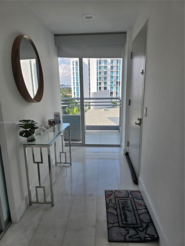 2950 NE 188th St Unit 501, Aventura, FL 33180 - hall with floor to ceiling windows and baseboards