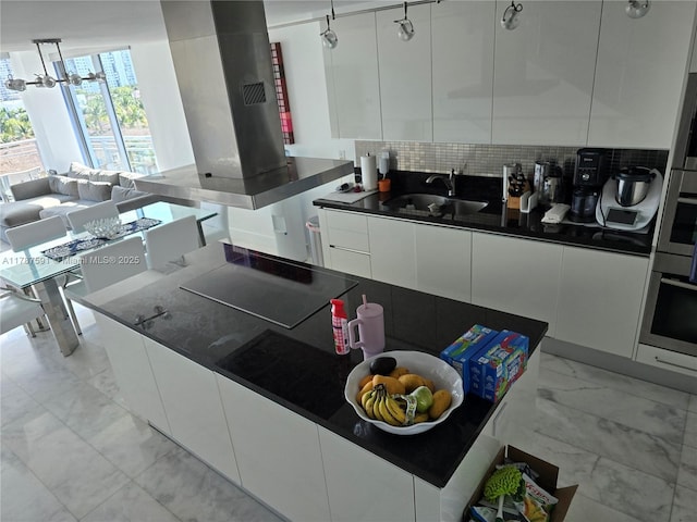 2950 NE 188th St Unit 501, Aventura, FL 33180 - kitchen featuring stainless steel oven, cooktop, modern cabinets, white cabinetry, and a sink