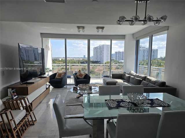 2950 NE 188th St Unit 501, Aventura, FL 33180 - dining area with light marble finish floors, a view of city, and plenty of natural light