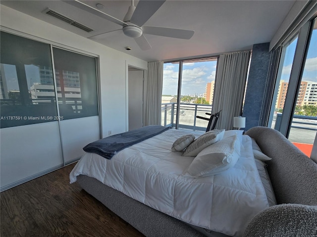 2950 NE 188th St Unit 501, Aventura, FL 33180 - bedroom with wood finished floors, access to exterior, a closet, and ceiling fan