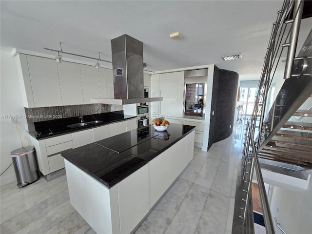 2950 NE 188th St Unit 501, Aventura, FL 33180 - kitchen with a sink, modern cabinets, black electric stovetop, and oven