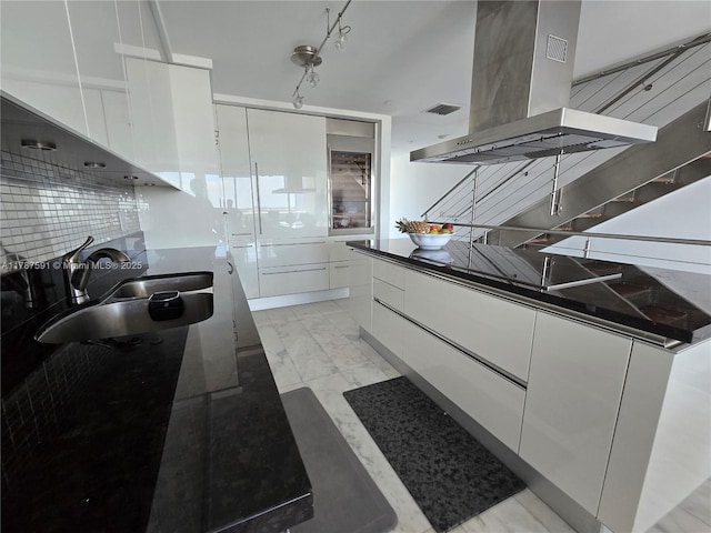 2950 NE 188th St Unit 501, Aventura, FL 33180 - kitchen with modern cabinets, a sink, island range hood, white cabinets, and light marble finish flooring