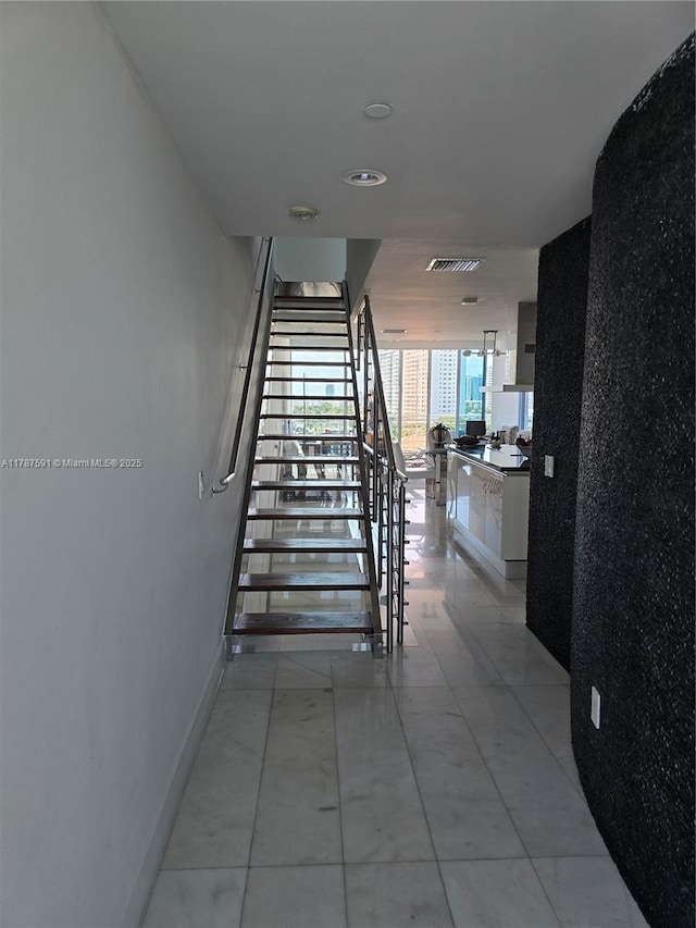 2950 NE 188th St Unit 501, Aventura, FL 33180 - stairs featuring baseboards and tile patterned flooring