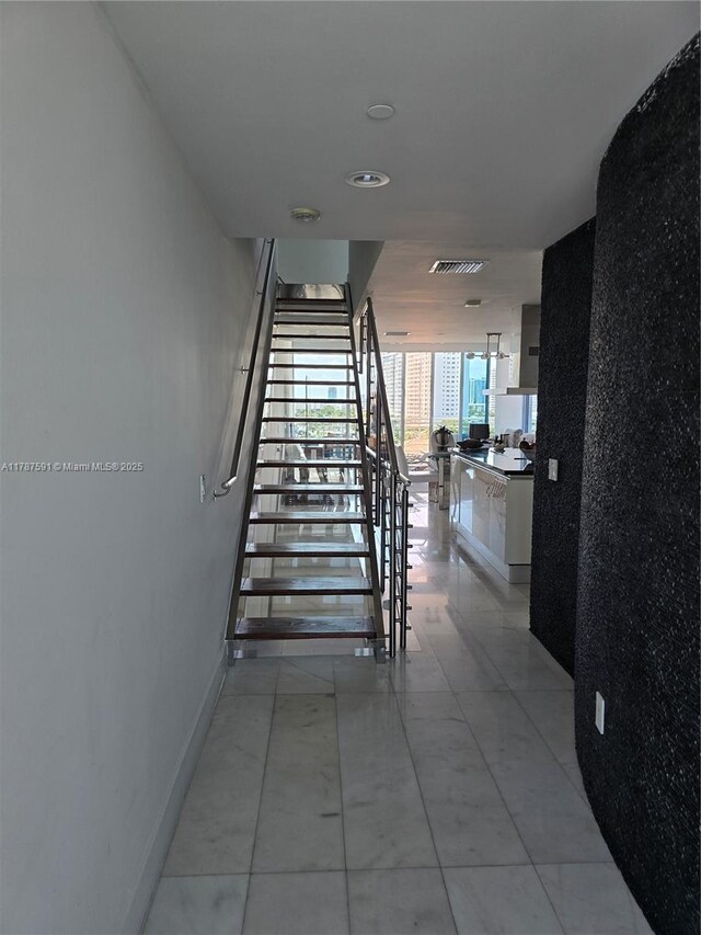 2950 NE 188th St Unit 501, Aventura, FL 33180 - stairs featuring baseboards and tile patterned flooring
