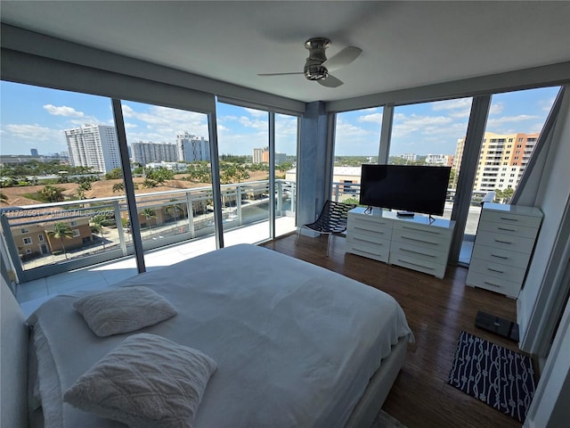 2950 NE 188th St Unit 501, Aventura, FL 33180 - bedroom featuring access to exterior, wood finished floors, and ceiling fan
