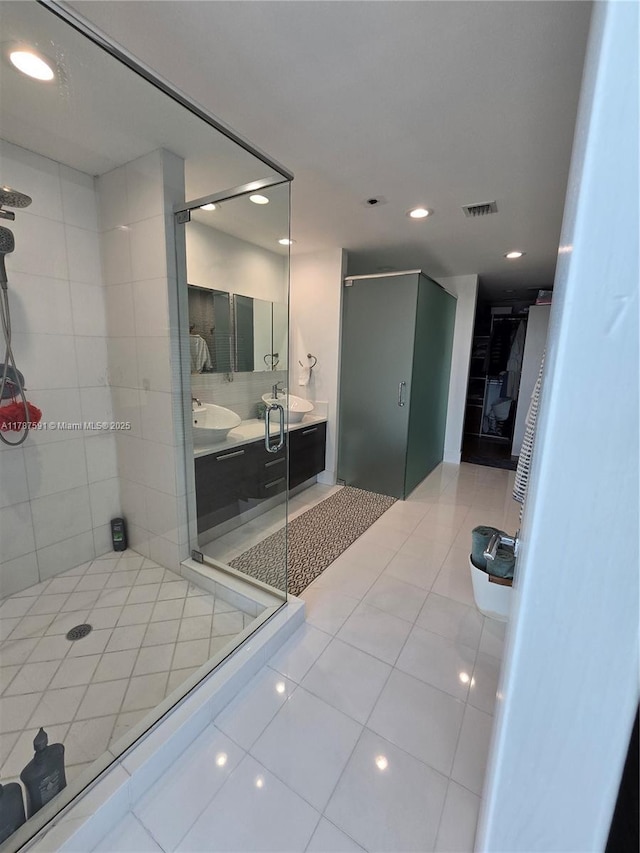 2950 NE 188th St Unit 501, Aventura, FL 33180 - full bathroom with a stall shower, recessed lighting, tile patterned floors, and double vanity