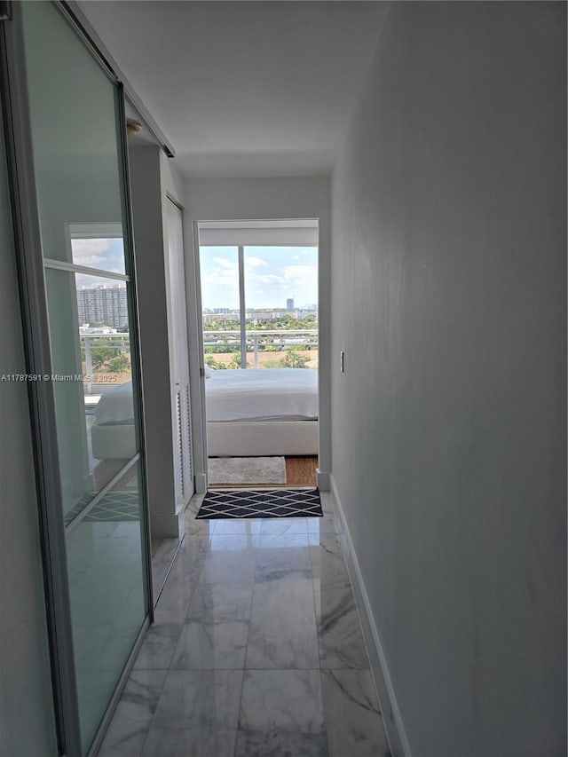 2950 NE 188th St Unit 501, Aventura, FL 33180 - corridor featuring light marble finish flooring and baseboards